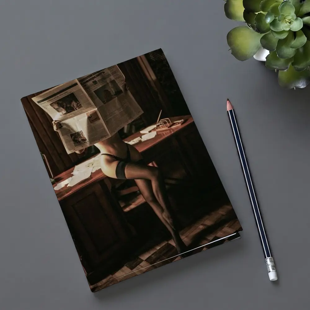 Sexy Woman Reading Newspaper at Office Desk – Notebooks