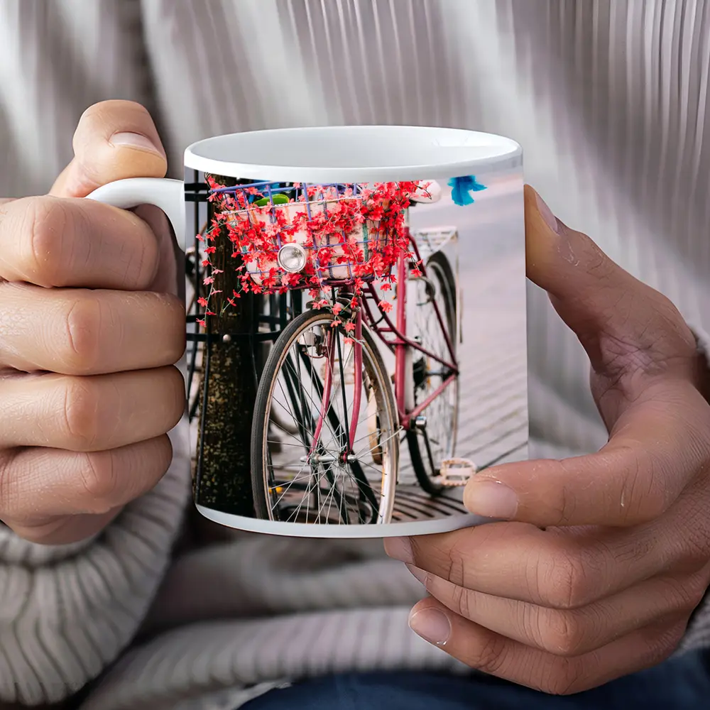 Pink Bicycle With Flowers On City Street – Mugs