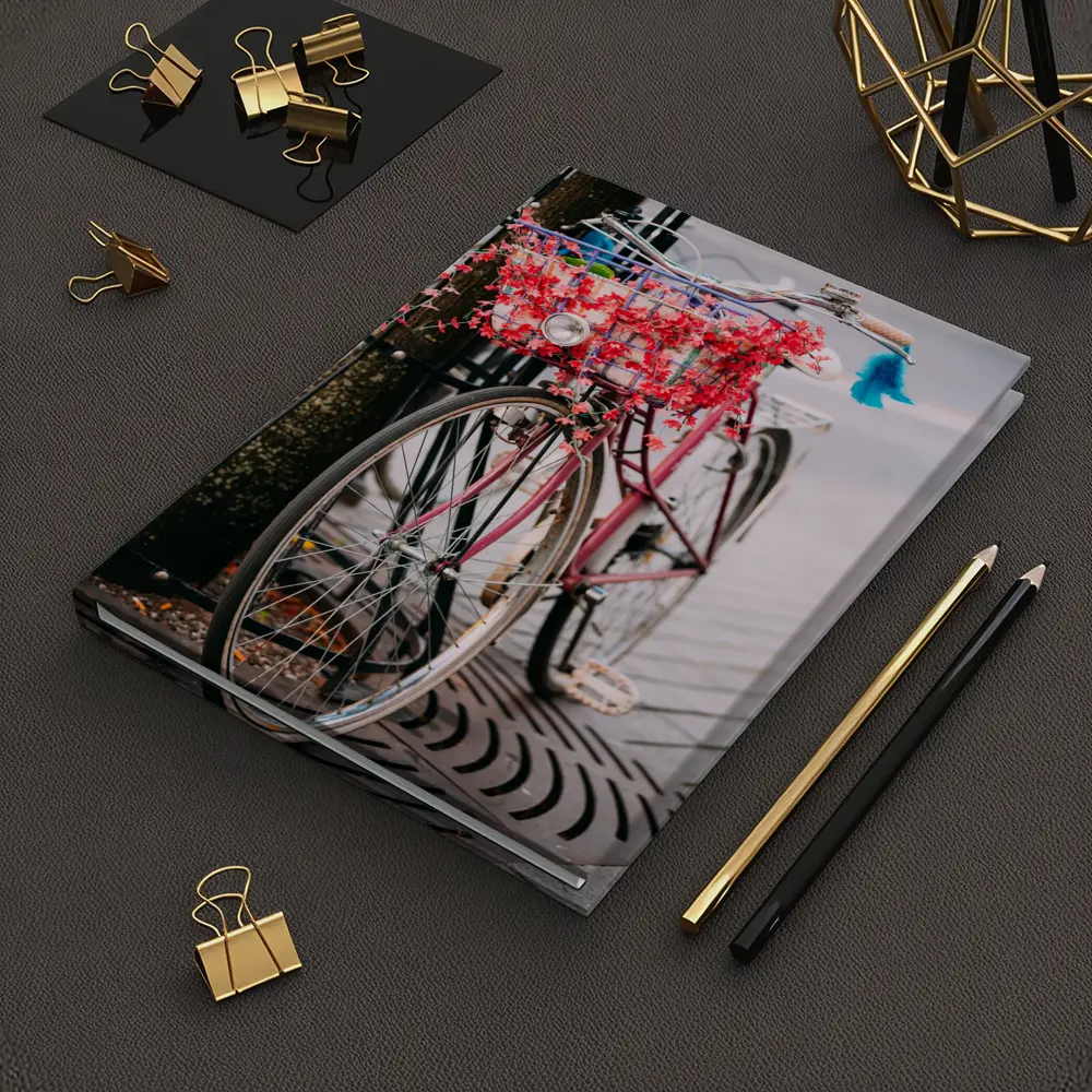 Pink Bicycle With Flowers On City Street – Notebooks