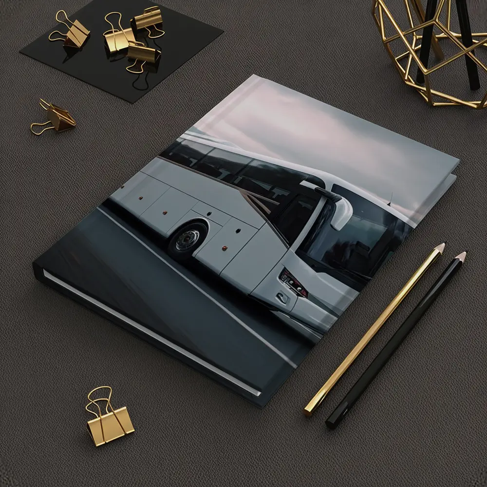 White Coach Bus Driving Through Mountain Road – Notebooks