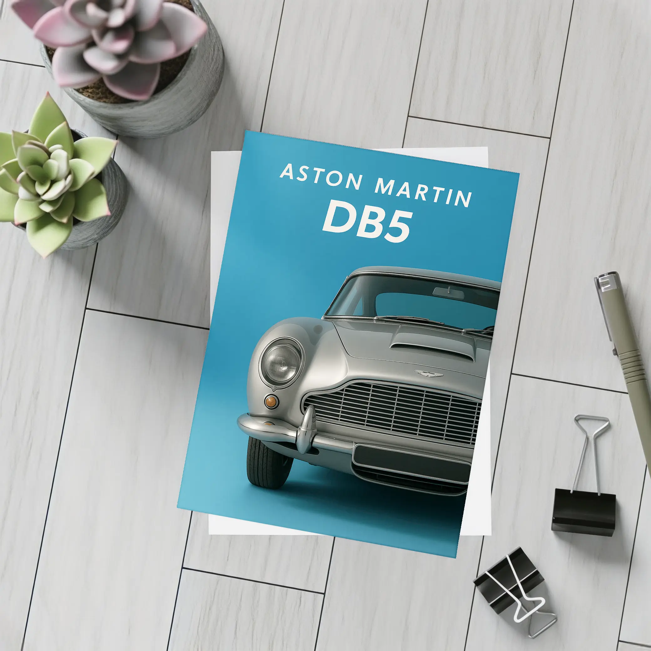 Aston Martin DB5 Silver Blue Background – Postcards