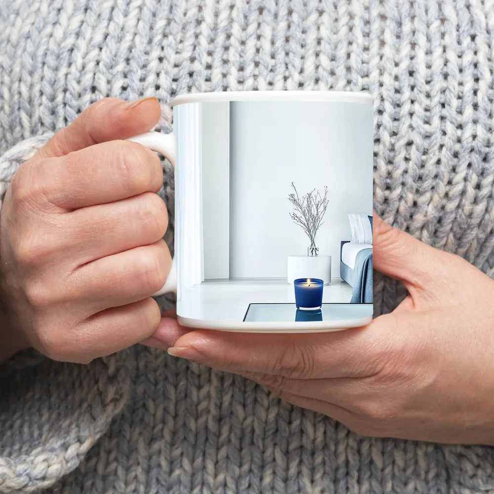 Blue Candle Glowing in Minimalist White Room – Mugs