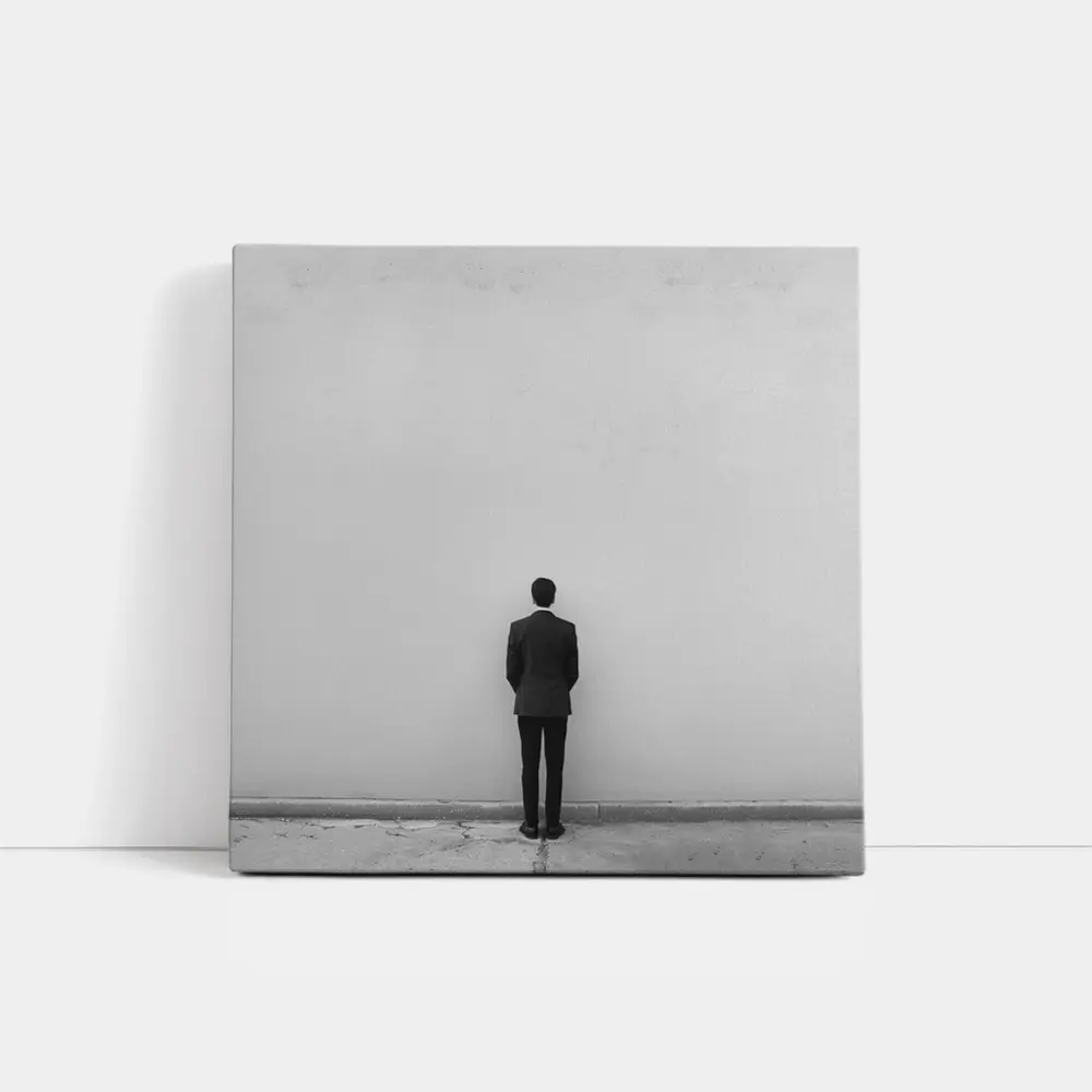 Man in Suit Standing Against White Wall – Wall Art