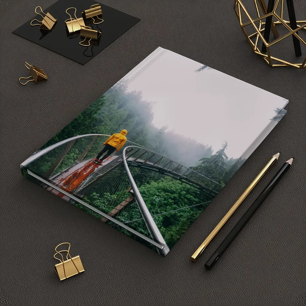 Yellow Jacket Hiker on Misty Forest Bridge – Notebooks