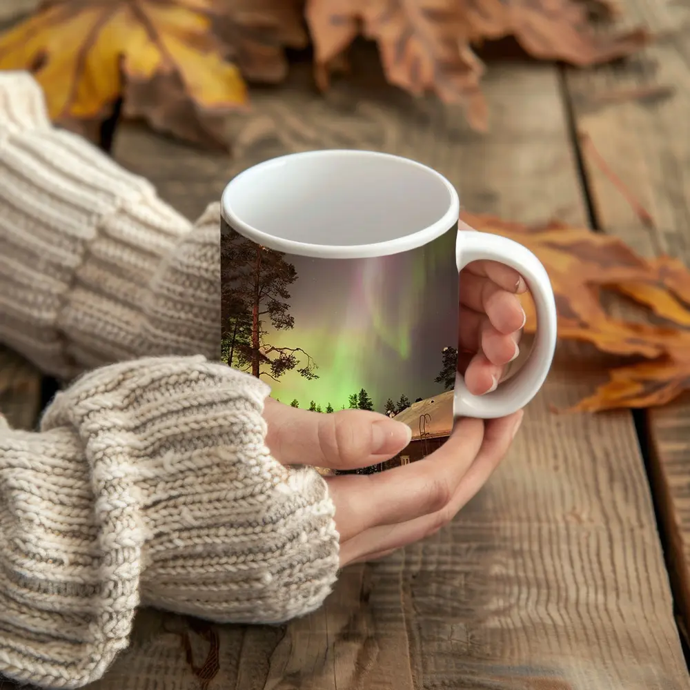 Northern Lights Over Snowy Winter Cabins – Mugs
