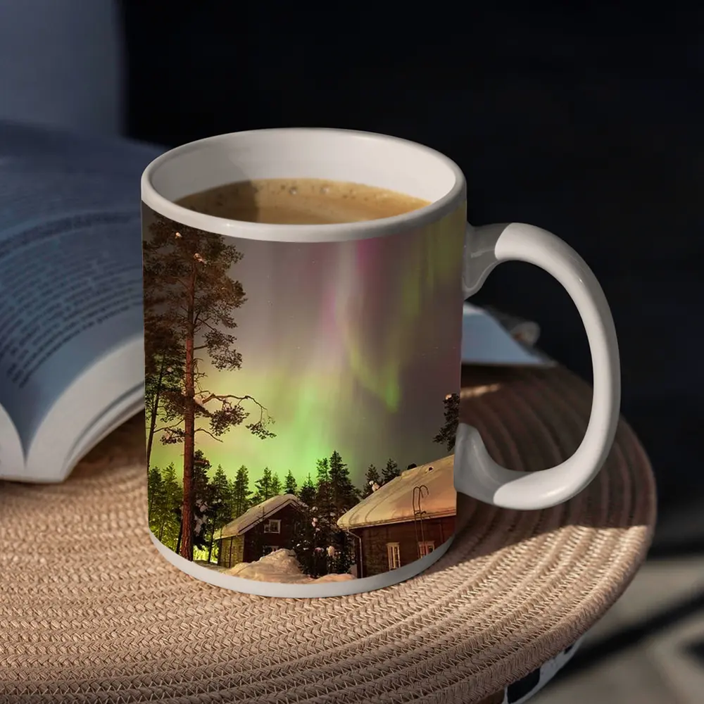 Northern Lights Over Snowy Winter Cabins – Mugs