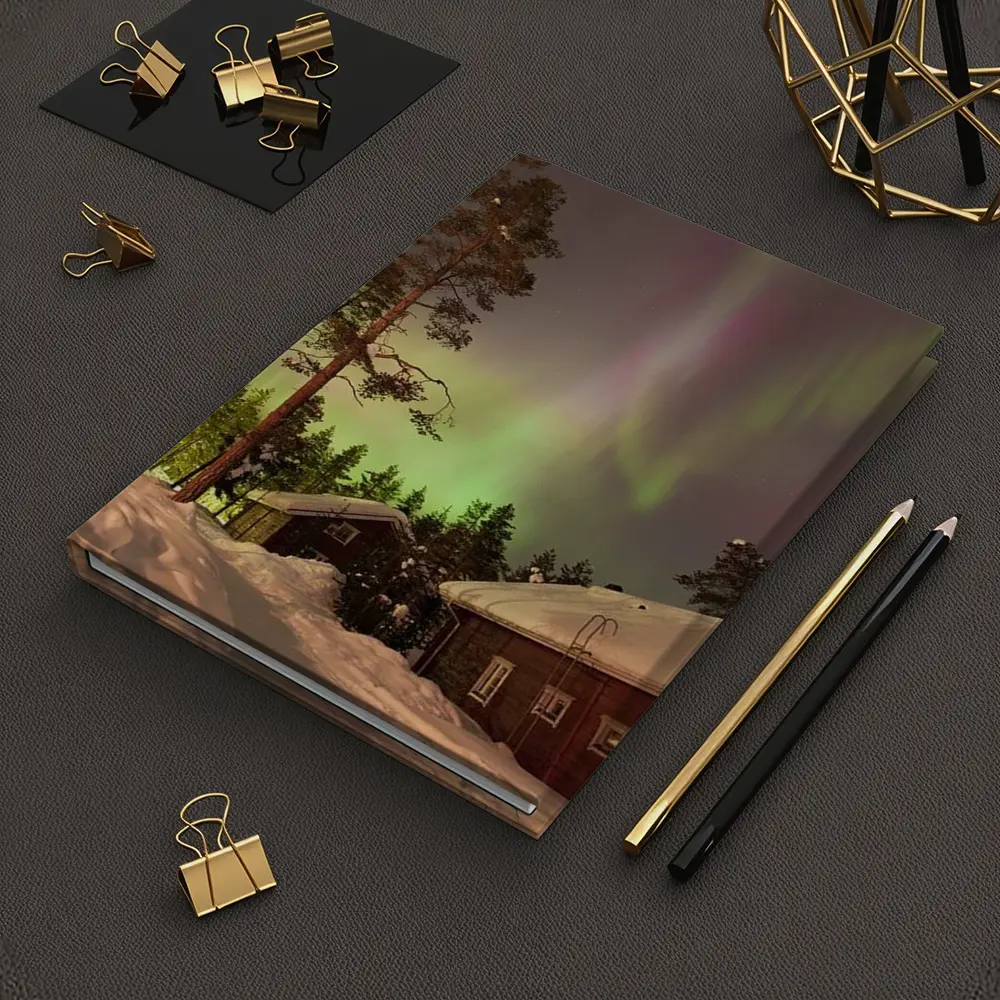 Northern Lights Over Snowy Winter Cabins – Notebooks