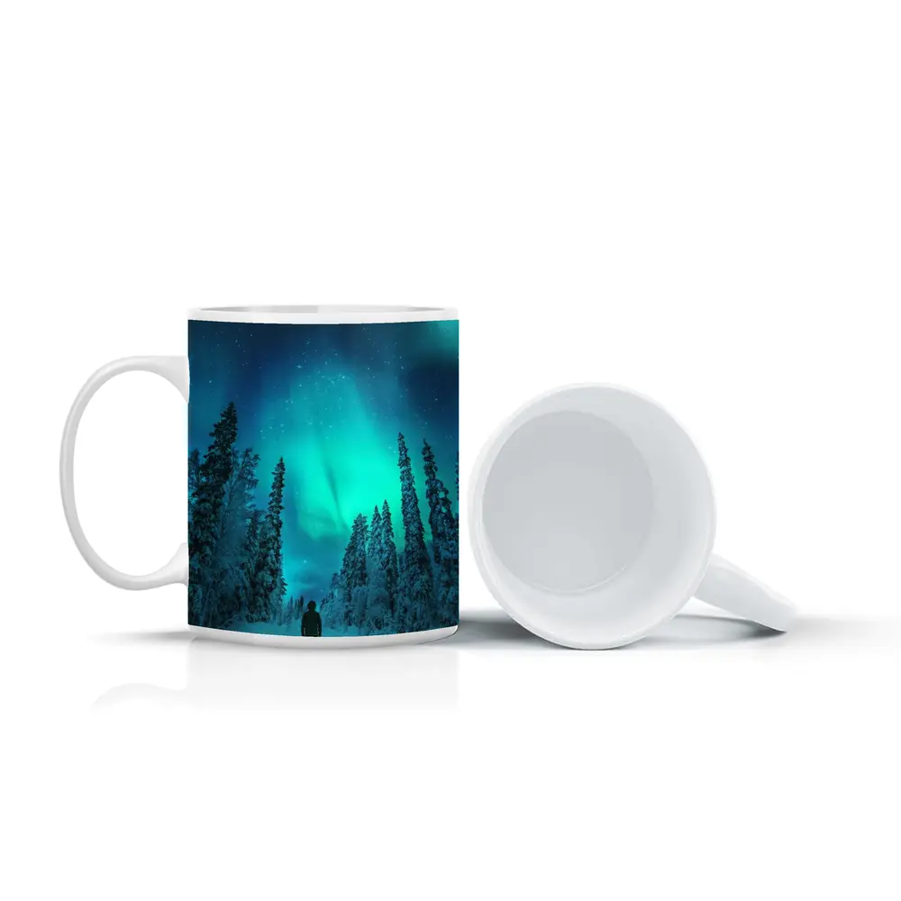 Person Standing Under Northern Lights Winter Forest – Mugs