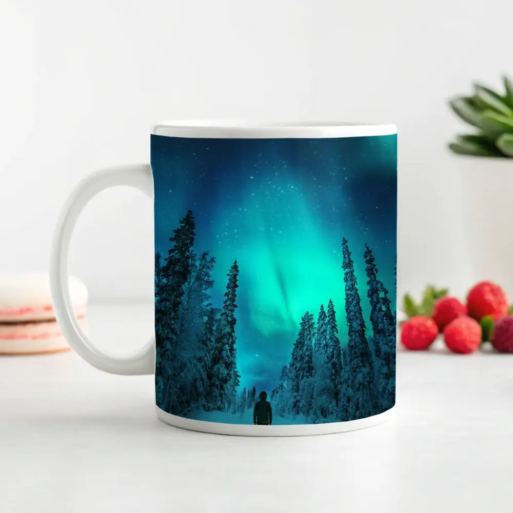 Person Standing Under Northern Lights Winter Forest – Mugs