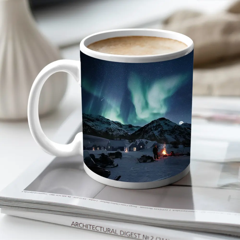Northern Lights Over Snowy Mountain Village – Mugs
