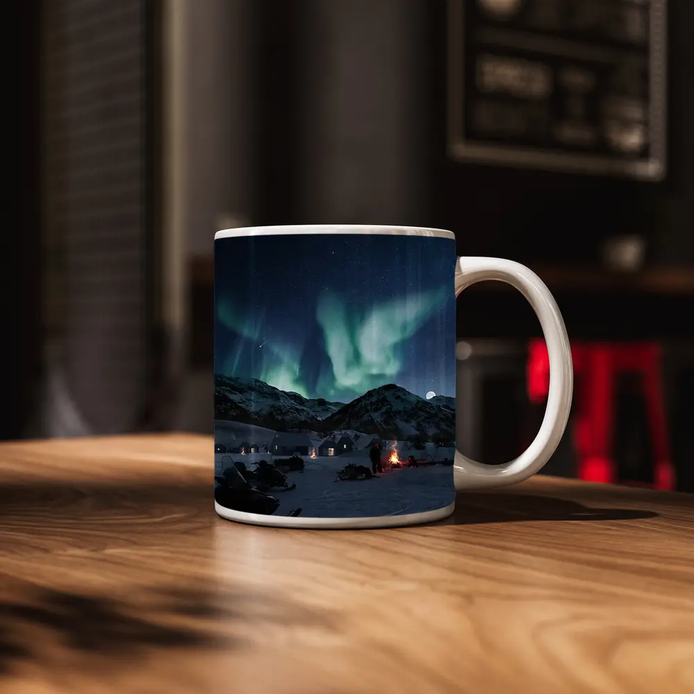 Northern Lights Over Snowy Mountain Village – Mugs