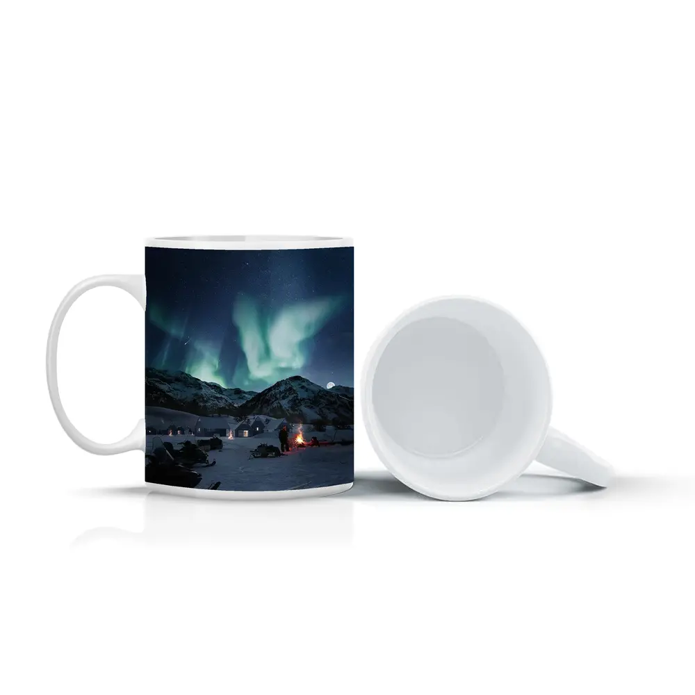 Northern Lights Over Snowy Mountain Village – Mugs