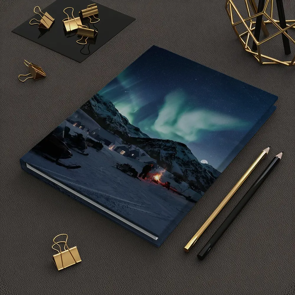 Northern Lights Over Snowy Mountain Village – Notebooks