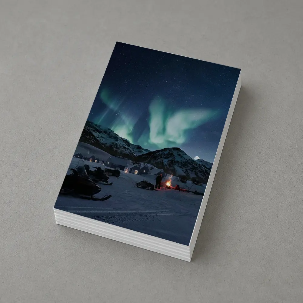 Northern Lights Over Snowy Mountain Village – Postcards