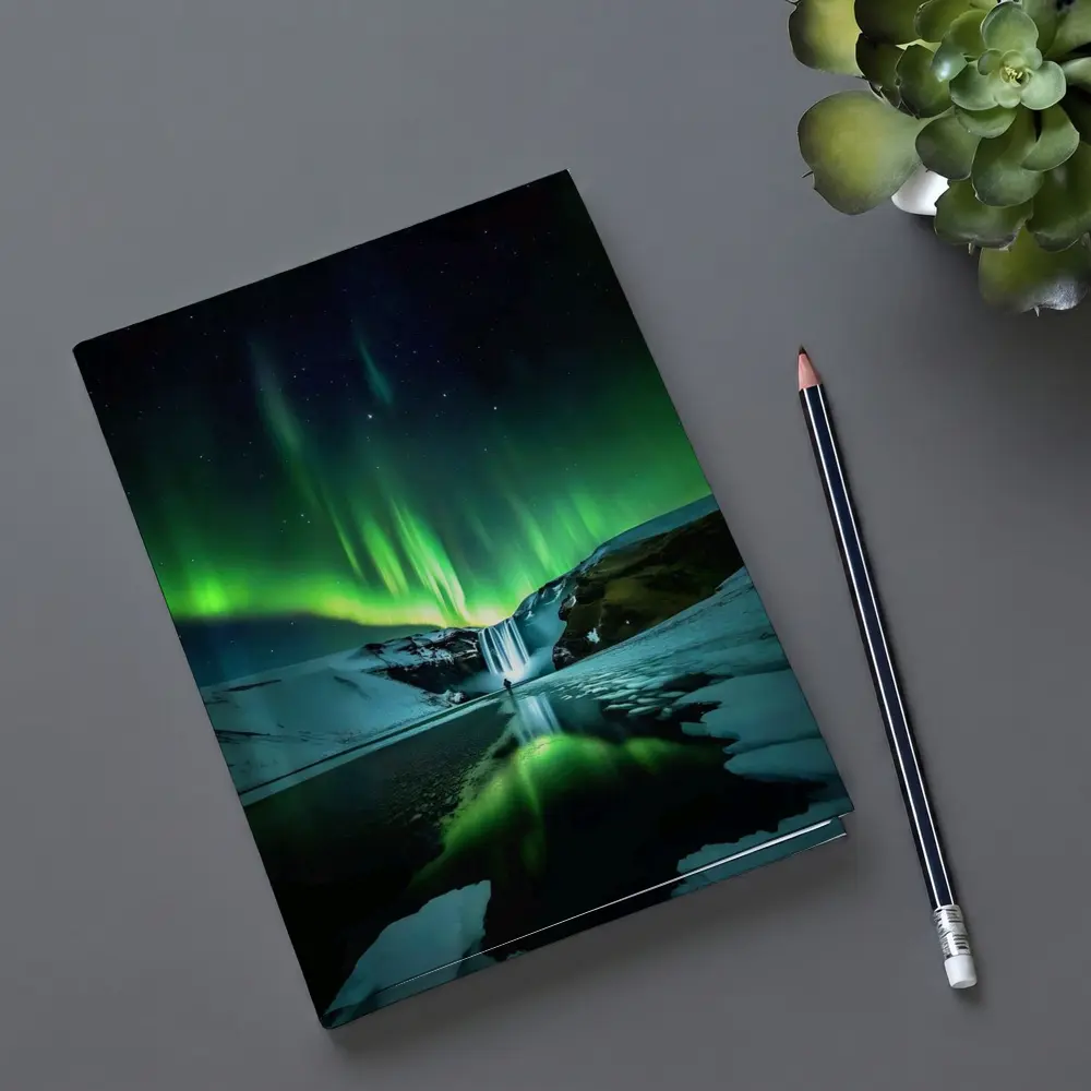 Northern Lights Over Snowy Waterfall Iceland – Notebooks