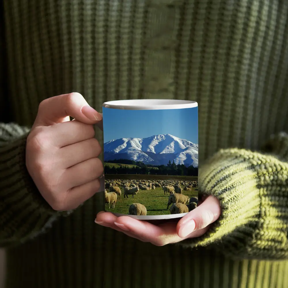 Sheep Flock Grazing Snow Capped Mountain – Mugs