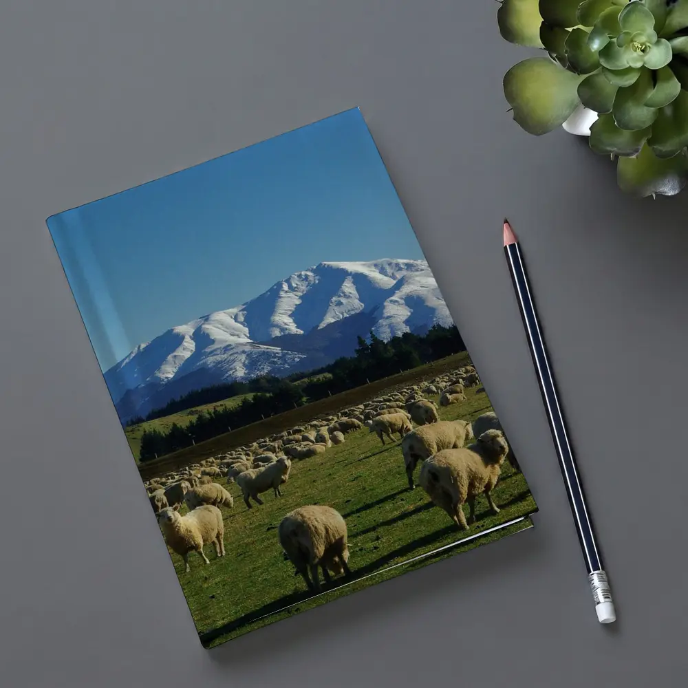 Sheep Flock Grazing Snow Capped Mountain – Notebooks