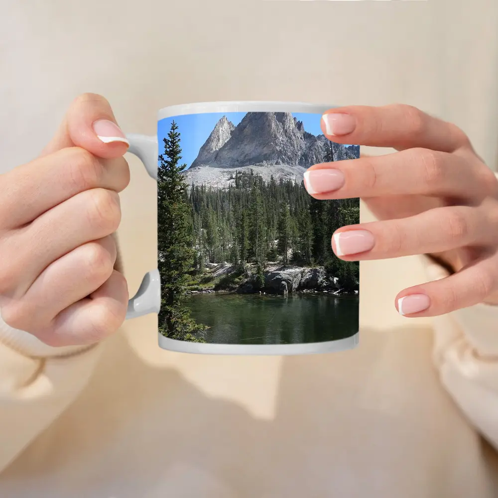 Rocky Mountain Peak Above Alpine Lake – Mugs