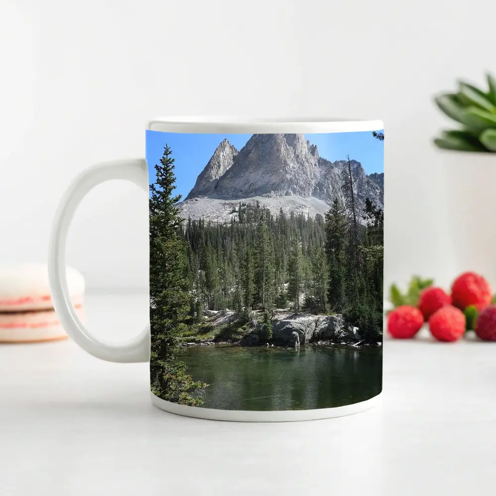 Rocky Mountain Peak Above Alpine Lake – Mugs