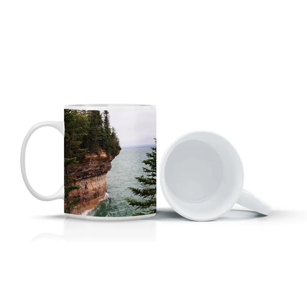 Red Sandstone Cliff Above Teal Lake – Mugs