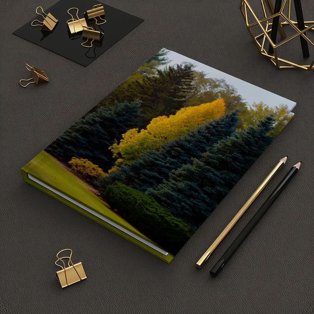 Yellow Autumn Tree Among Blue Spruce Forest – Notebooks