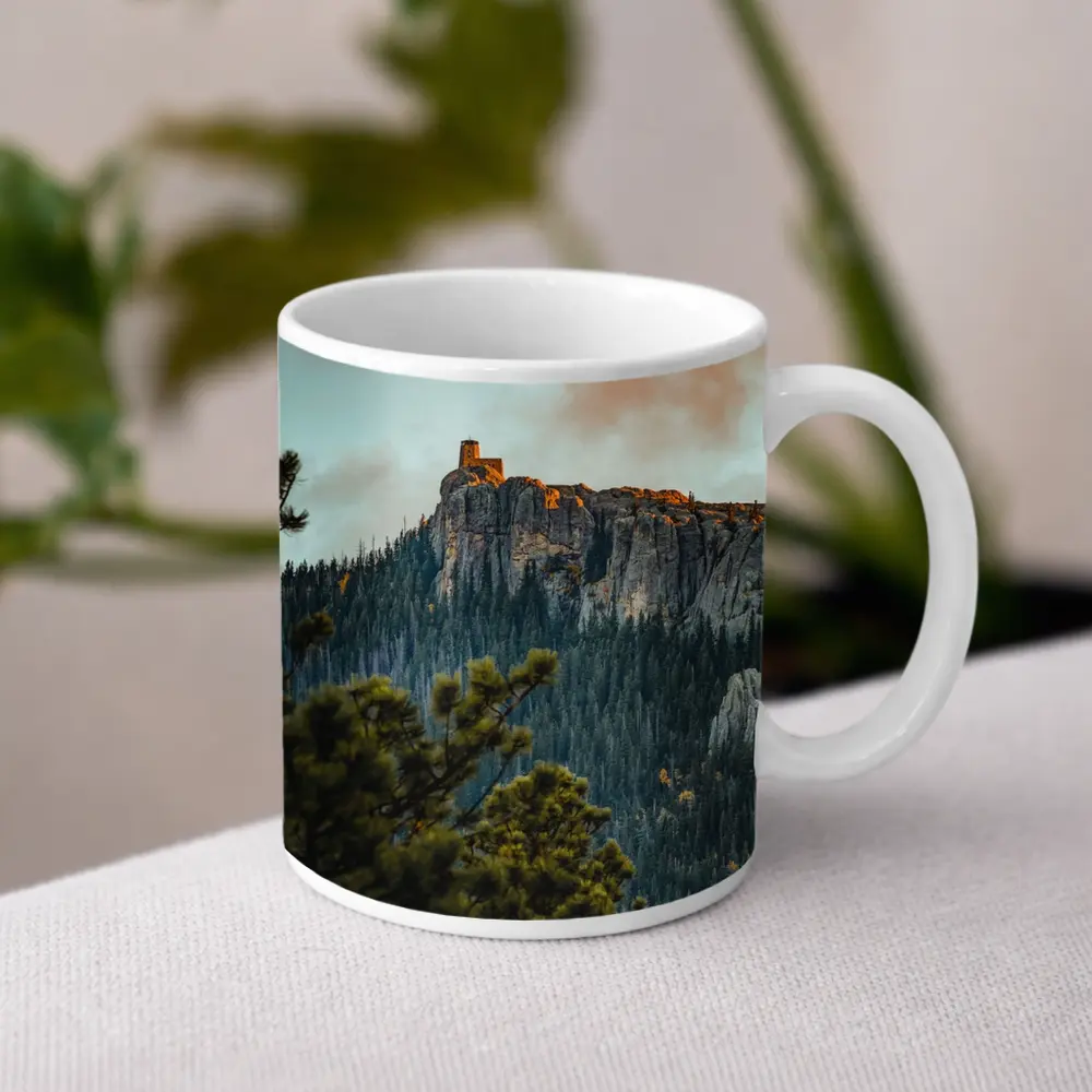 Stone Watchtower Atop Rocky Mountain Cliff – Mugs