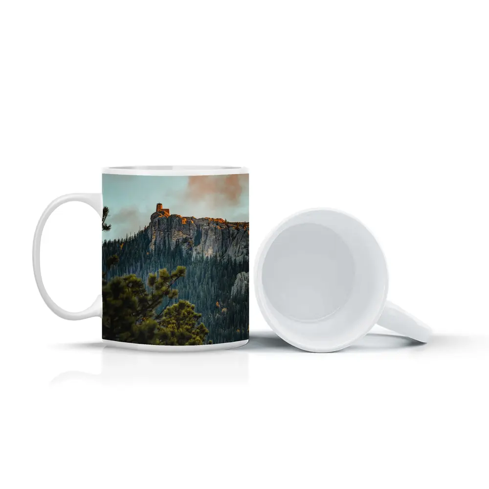 Stone Watchtower Atop Rocky Mountain Cliff – Mugs