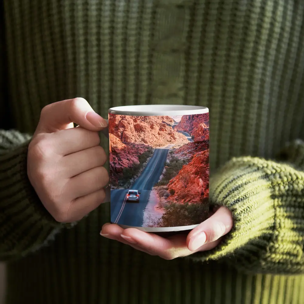 SUV Driving Through Red Rock Canyon Road – Mugs