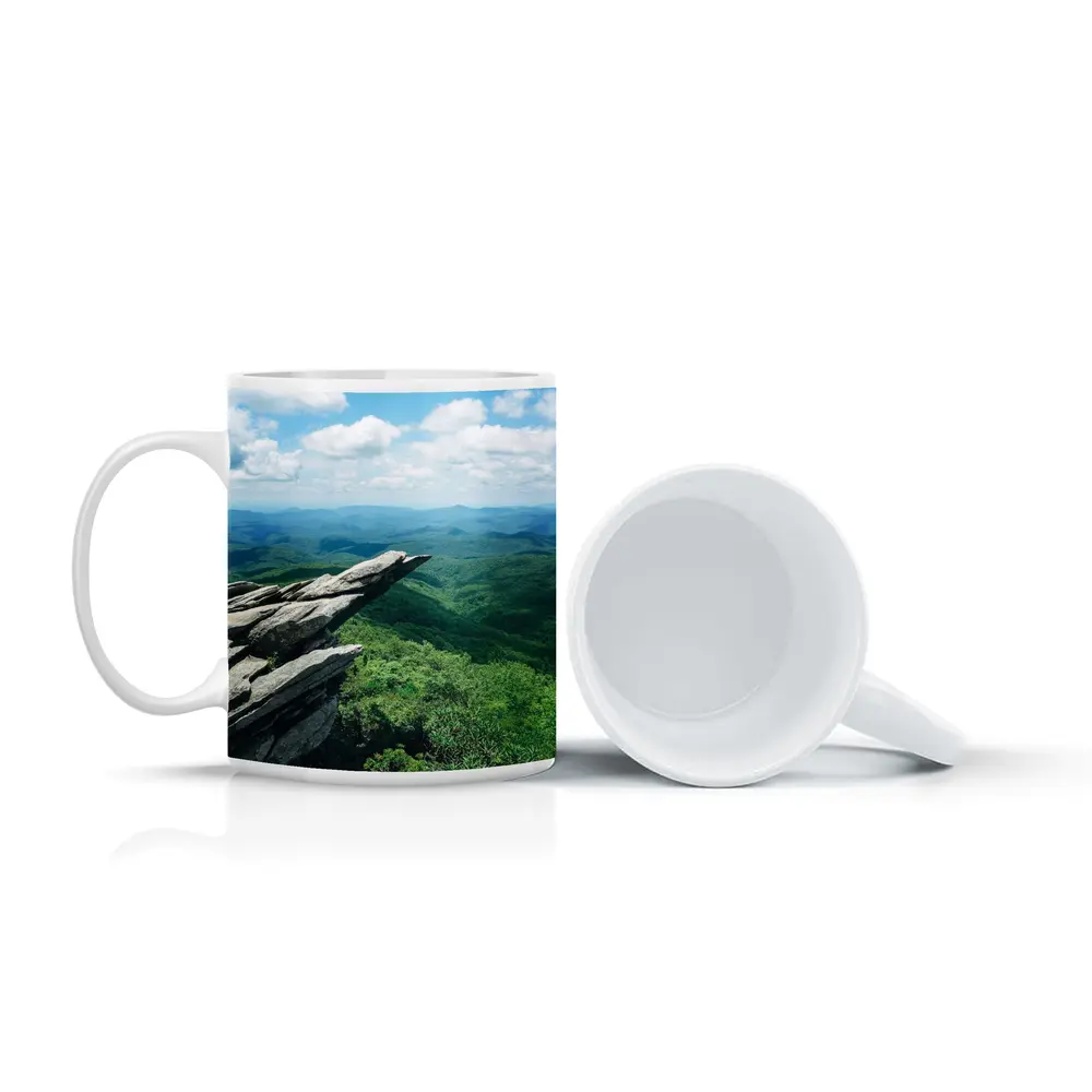 Rocky Cliff Overlooking Green Mountain Valleys – Mugs