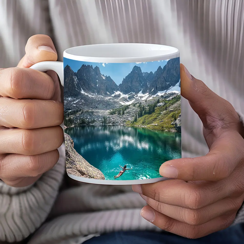 Person Swimming Alpine Lake Jagged Mountain Peaks – Mugs