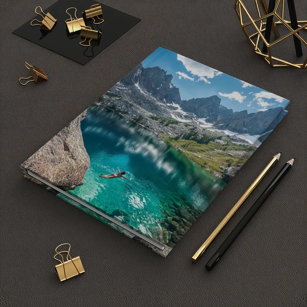 Person Swimming Alpine Lake Jagged Mountain Peaks – Notebooks