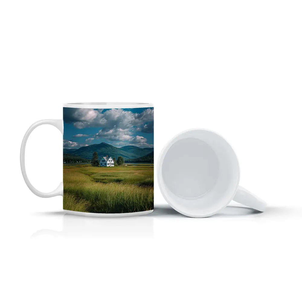 White Farmhouse Green Fields Mountain Landscape – Mugs