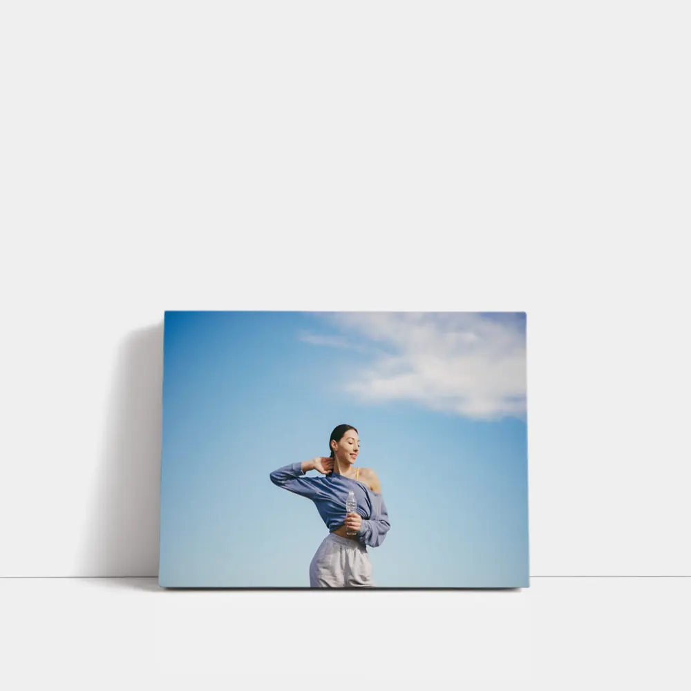 Woman Stretching Outdoors Under Blue Sky – Wall Art