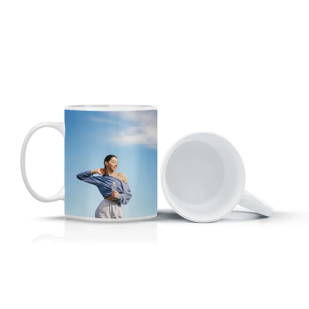 Woman Stretching Outdoors Under Blue Sky – Mugs