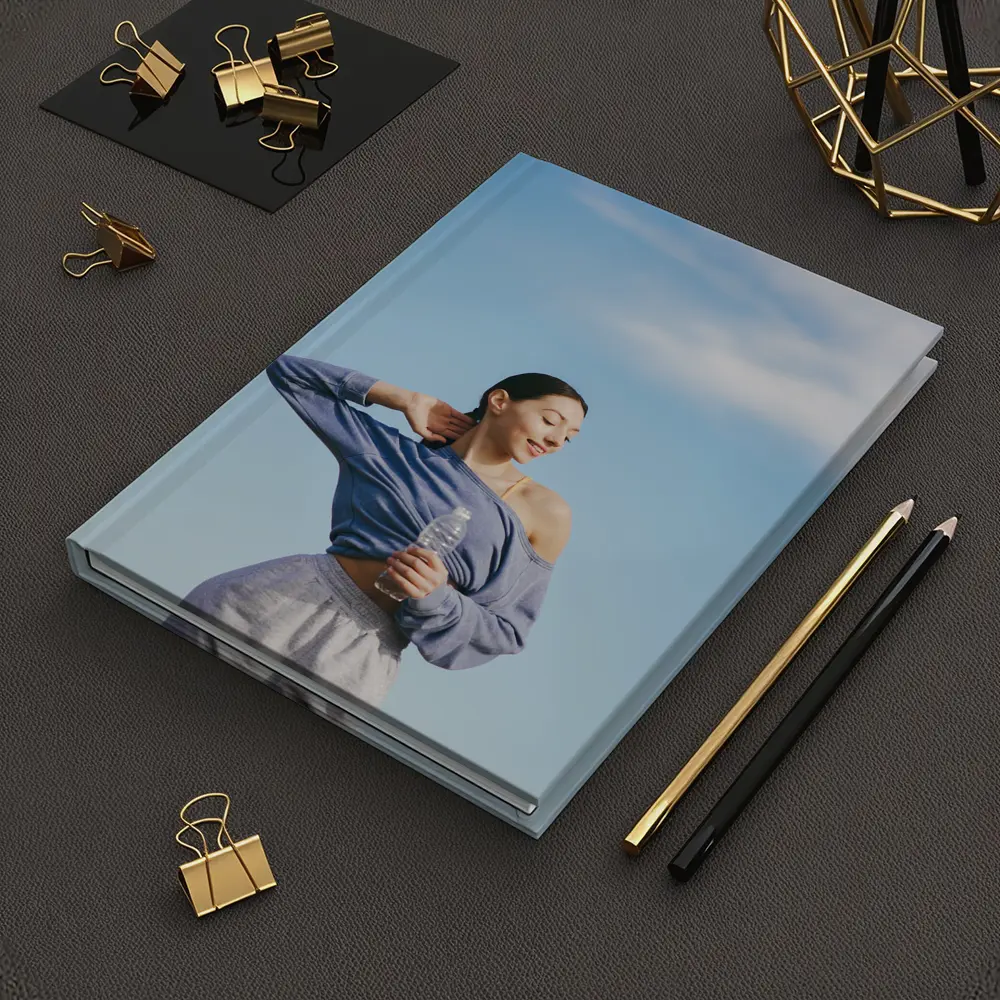 Woman Stretching Outdoors Under Blue Sky – Notebooks