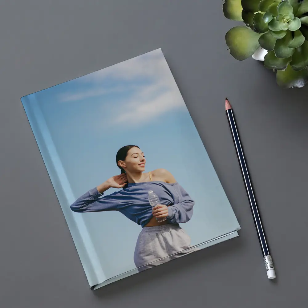Woman Stretching Outdoors Under Blue Sky – Notebooks