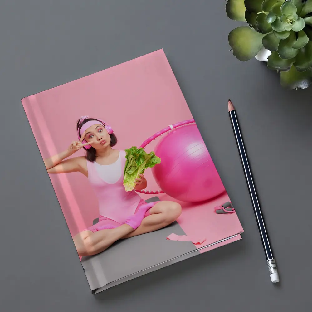 Fitness Girl Sitting With Exercise Ball Pink – Notebooks