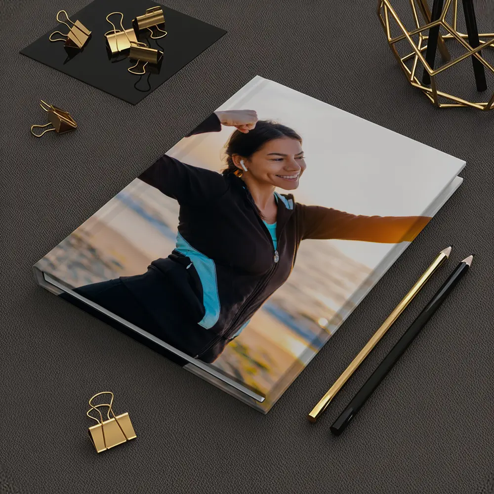 Woman Celebrating Victory at Sunrise Beach – Notebooks