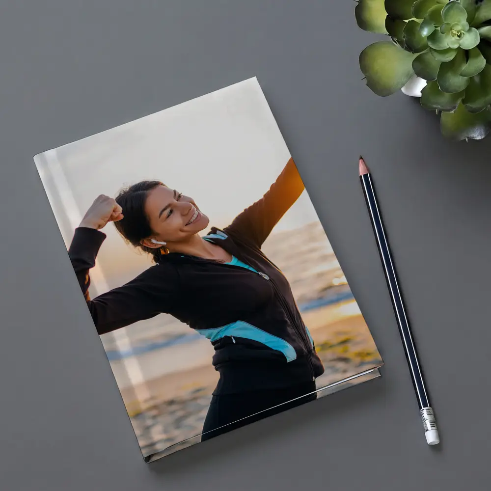 Woman Celebrating Victory at Sunrise Beach – Notebooks