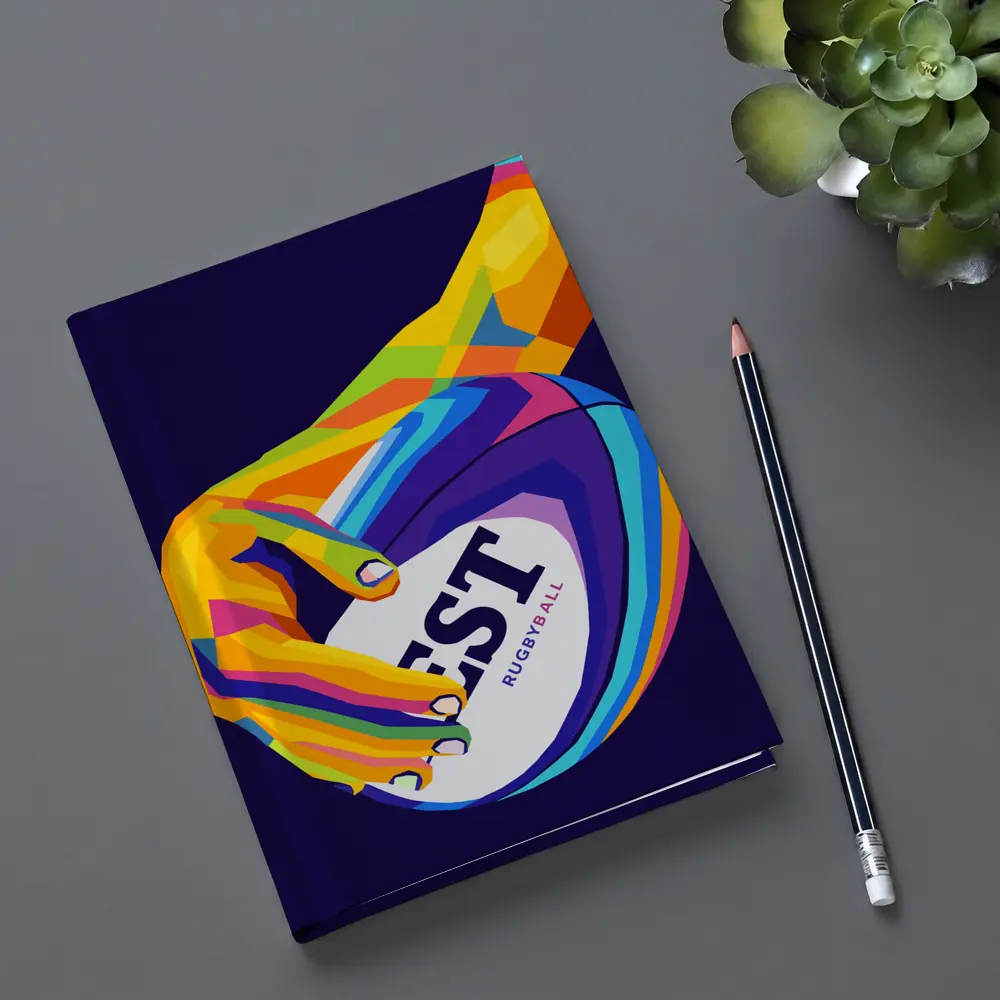 Rainbow Hand Gripping Rugby Ball Dark Background – Notebooks