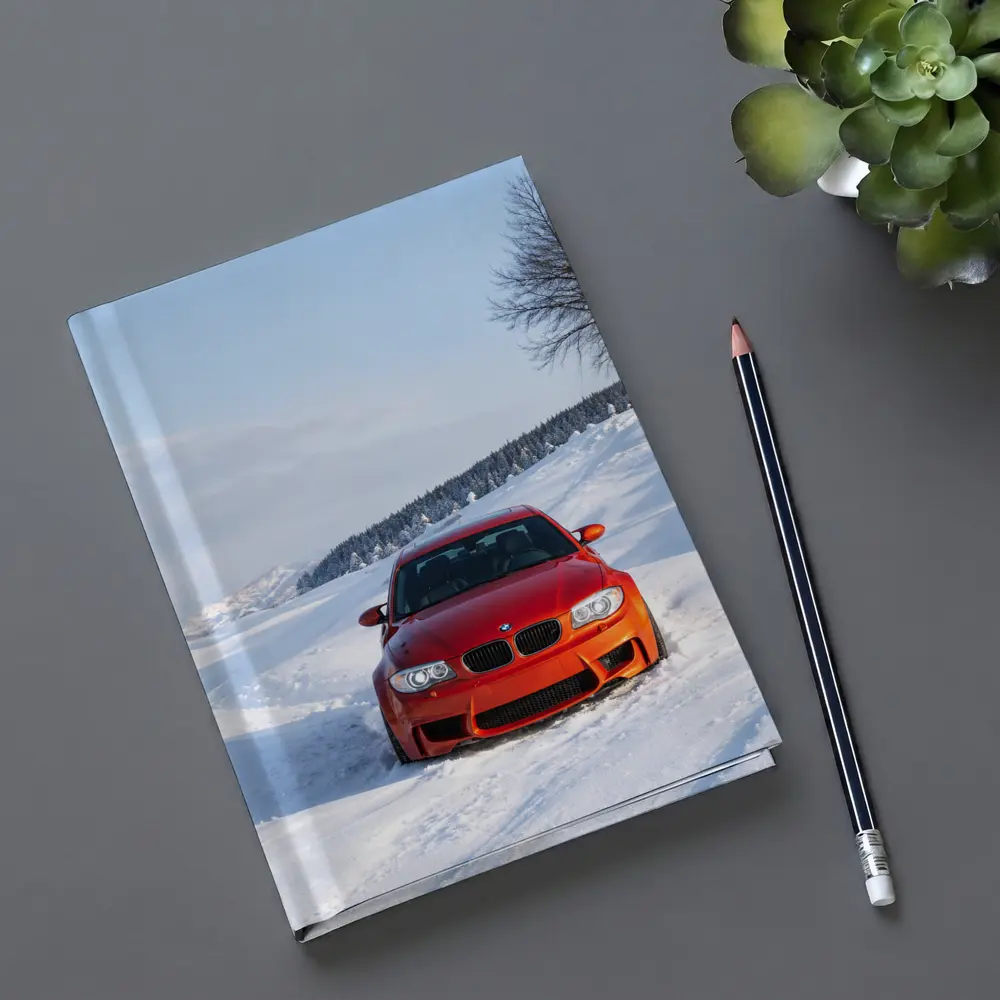BMW M1 Orange Car In Snow – Notebooks