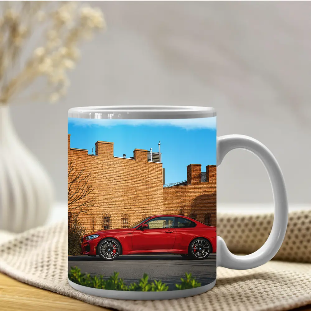 Red BMW M2 Parked Against Brick Wall – Mugs