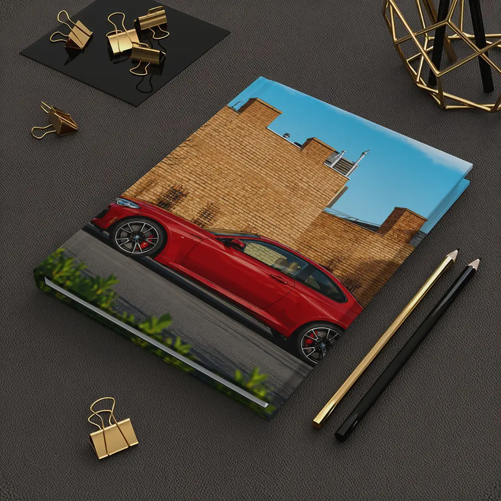 Red BMW M2 Parked Against Brick Wall – Notebooks