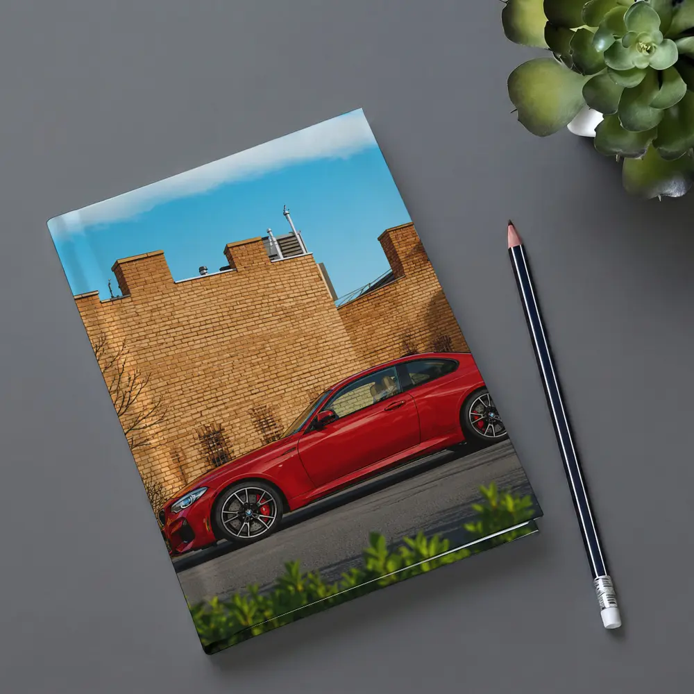 Red BMW M2 Parked Against Brick Wall – Notebooks