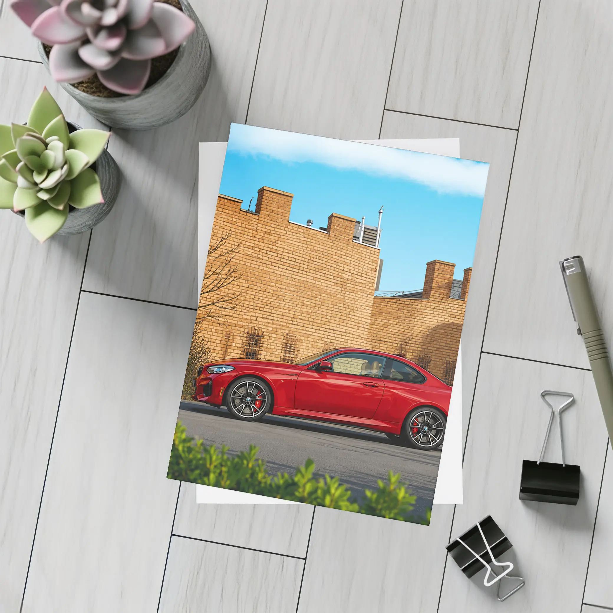Red BMW M2 Parked Against Brick Wall – Postcards