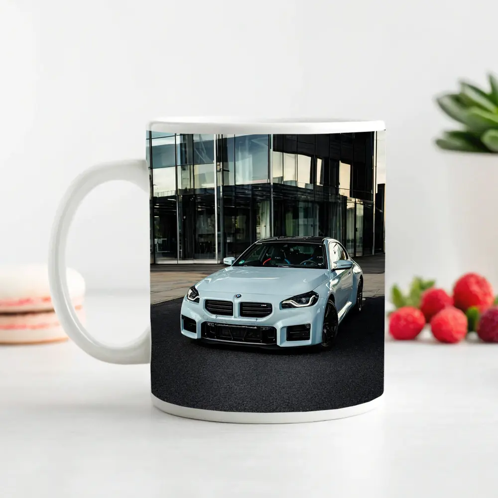 BMW M2 White Parked Outside Glass Building – Mugs