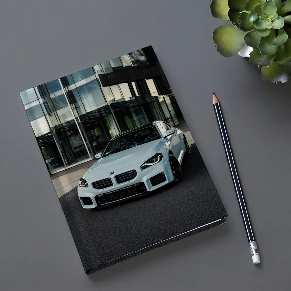 BMW M2 White Parked Outside Glass Building – Notebooks