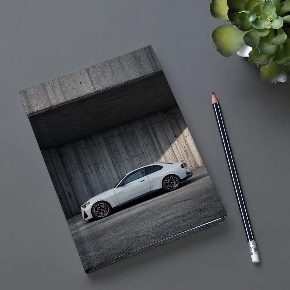 BMW M2 Coupe Parked Against Concrete Wall – Notebooks