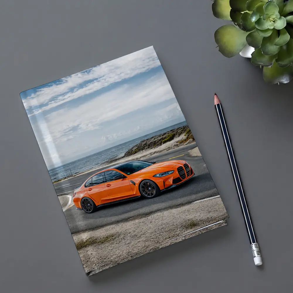 BMW M3 Orange Sedan Coastal Road Shot – Notebooks