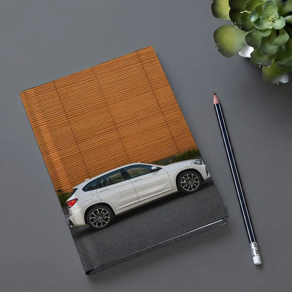 BMW X1 White SUV Orange Wall Background – Notebooks